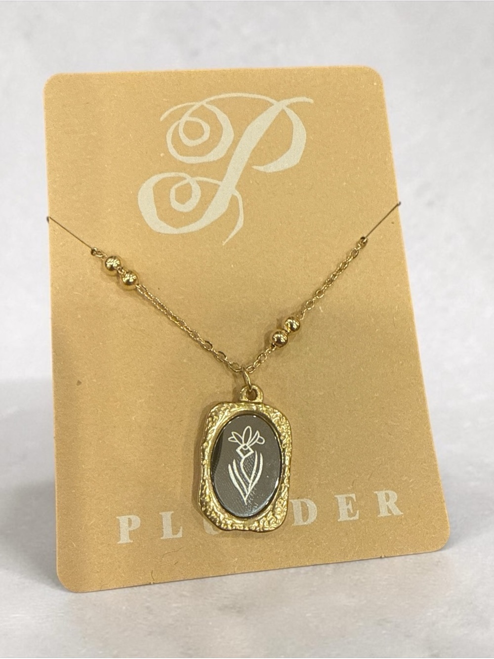 Plunder Gold-tone Floral Frame Necklace with Silver Center